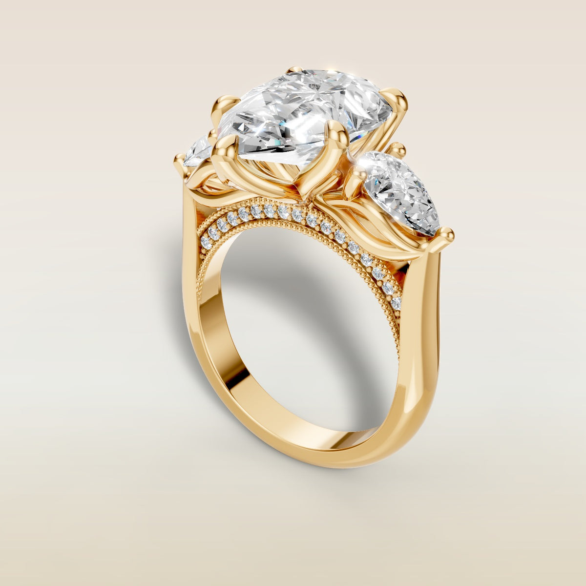 Pear Tulip Three Stone Diamond Bridge engagement ring in yellow gold, back angle
