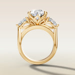 Pear Tulip Three Stone Diamond Bridge engagement ring in yellow gold, front view
