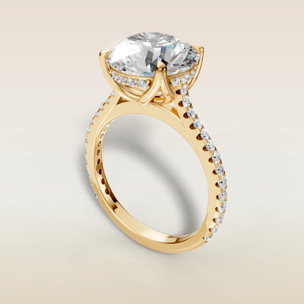 Round Tulip Hidden Halo Pave engagement ring in yellow gold, angled view