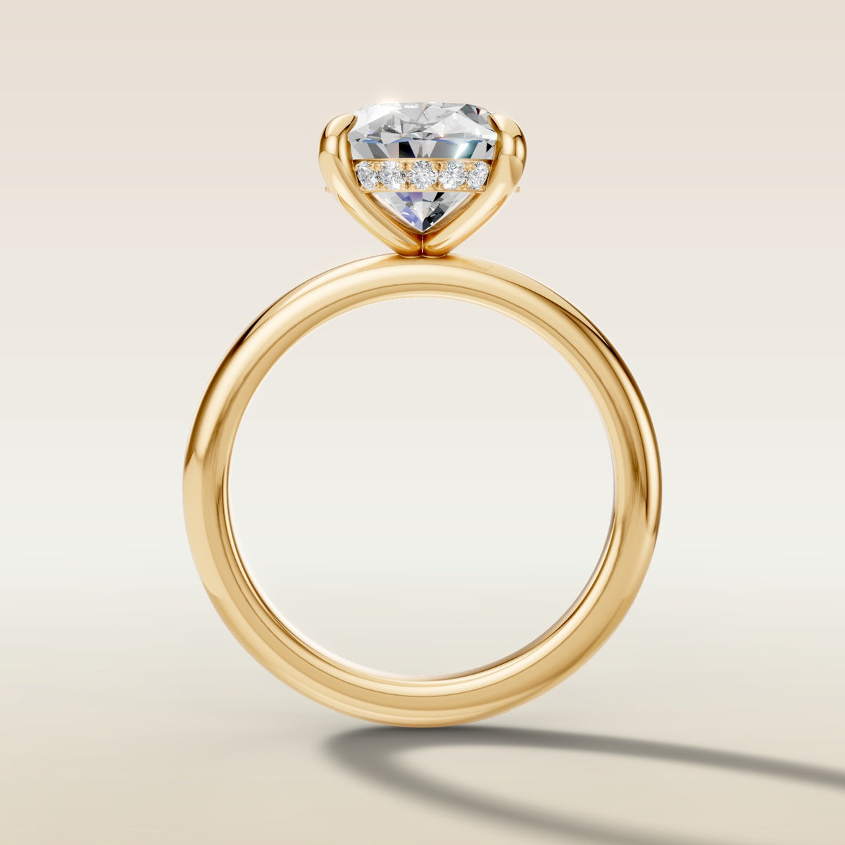 Oval Hidden Halo Solitaire engagement ring in yellow gold
