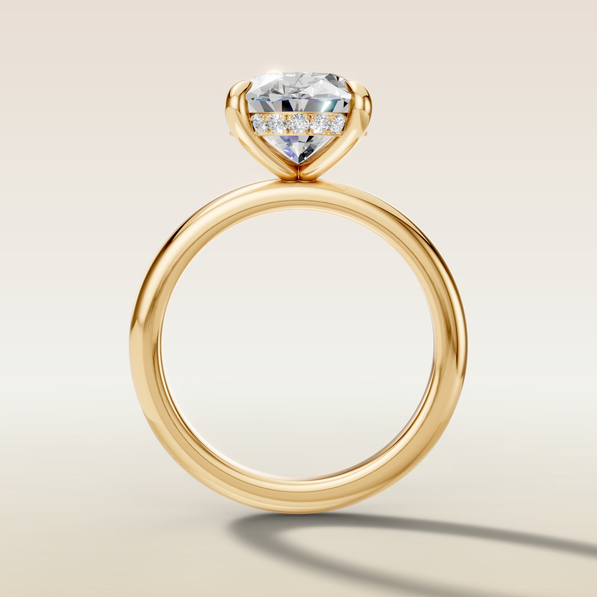 Oval Hidden Halo Solitaire engagement ring in yellow gold, front view