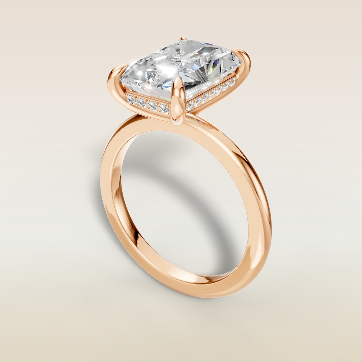Radiant Hidden Halo Solitaire engagement ring in rose gold, angled view