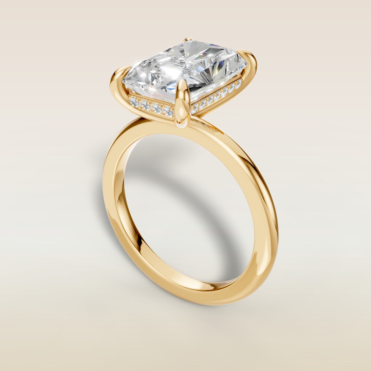 Radiant Hidden Halo Solitaire engagement ring in yellow gold, angled view
