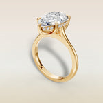 Pear Tulip with Hidden Halo engagement ring in yellow gold, angled view