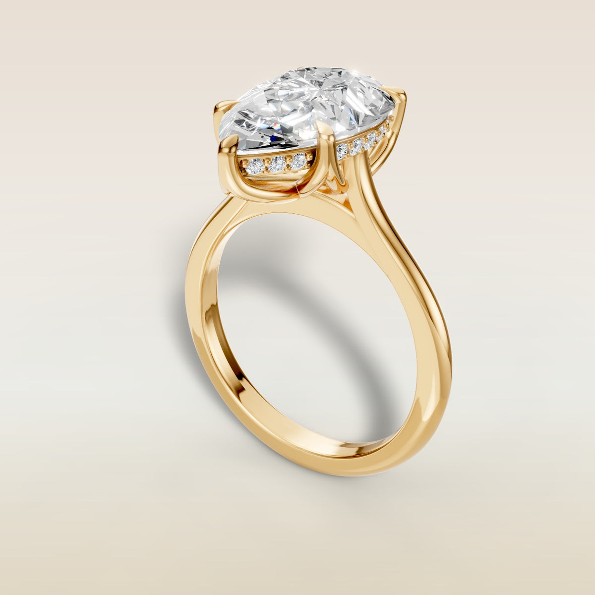Pear Tulip with Hidden Halo engagement ring in yellow gold, angled view