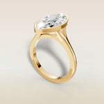 Marquise Full Bezel Split Shank engagement ring in yellow gold, angled view