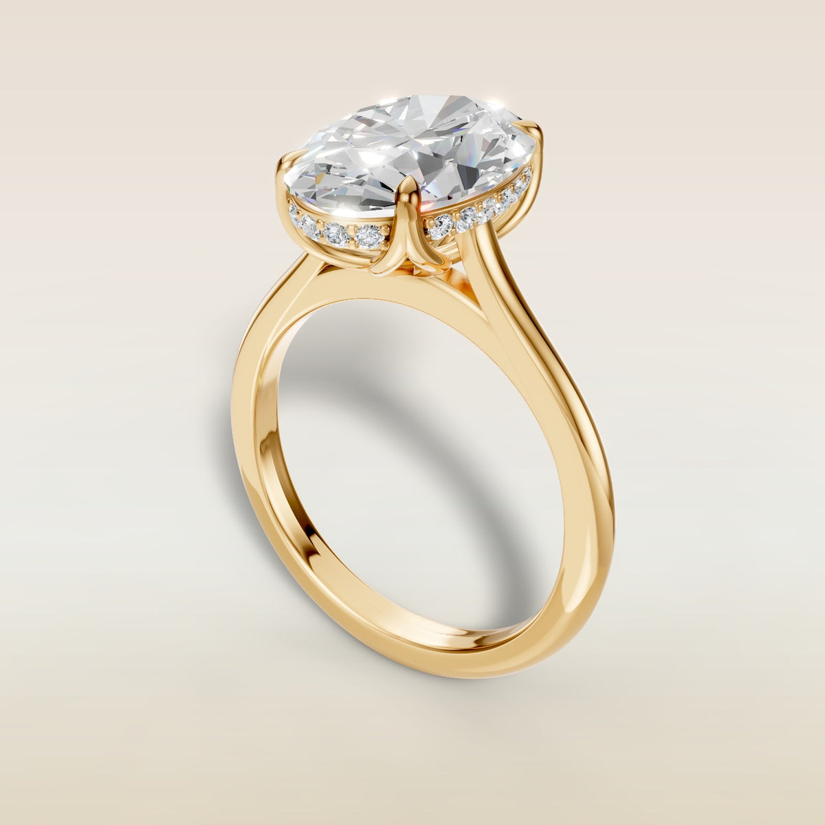Oval Tulip with Hidden Halo engagement ring in yellow gold, angled view