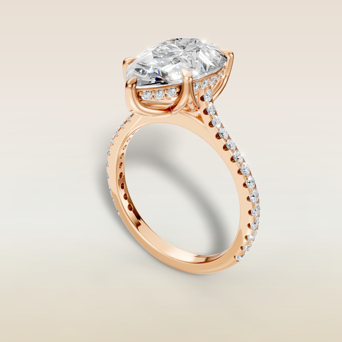 Pear Tulip Hidden Halo Pave engagement ring in rose gold, angled view