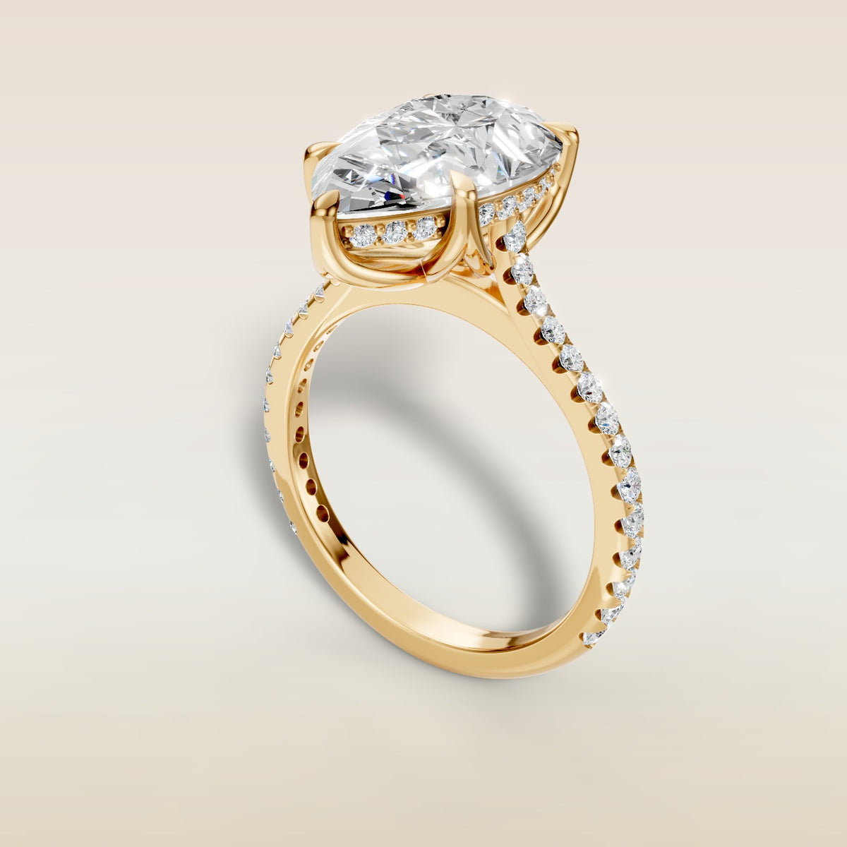 Pear Tulip Hidden Halo Pave engagement ring in yellow gold, angled view