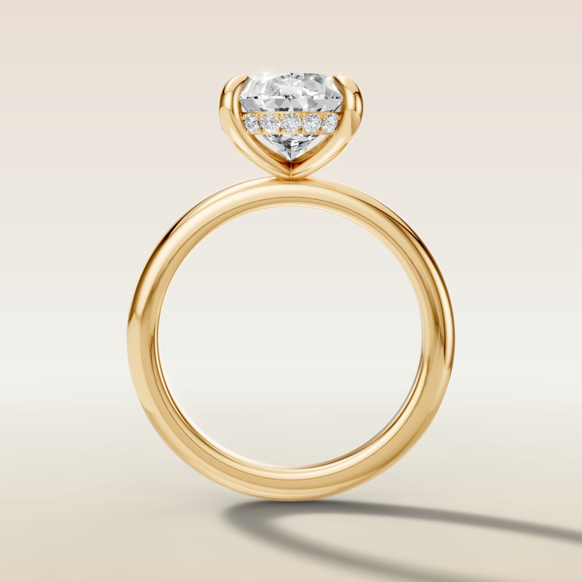 Pear Hidden Halo Solitaire engagement ring in yellow gold, front view