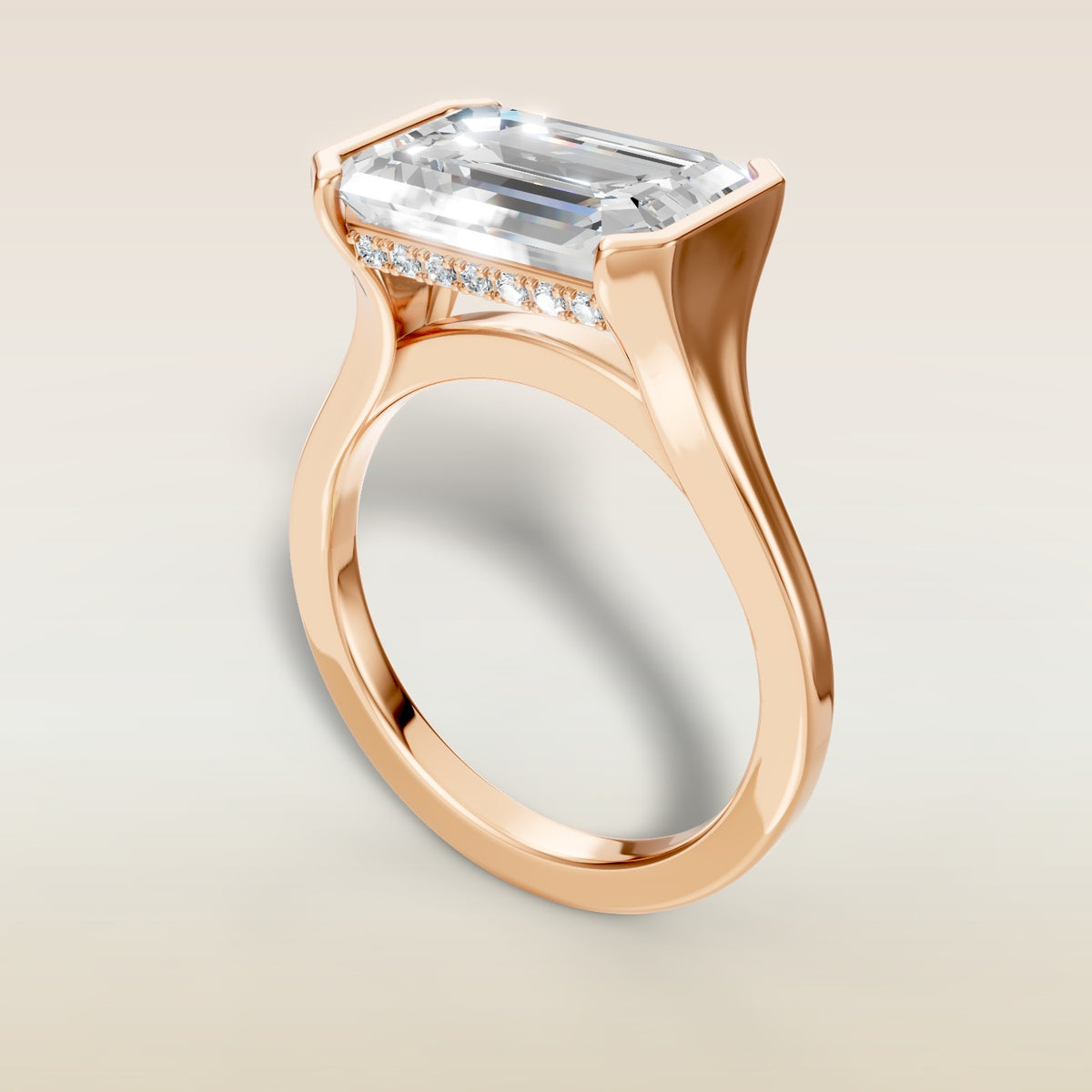 Emerald Half Bezel with Hidden Halo engagement ring in rose gold, angled view