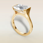 Emerald Half Bezel with Hidden Halo engagement ring in yellow gold, angled view