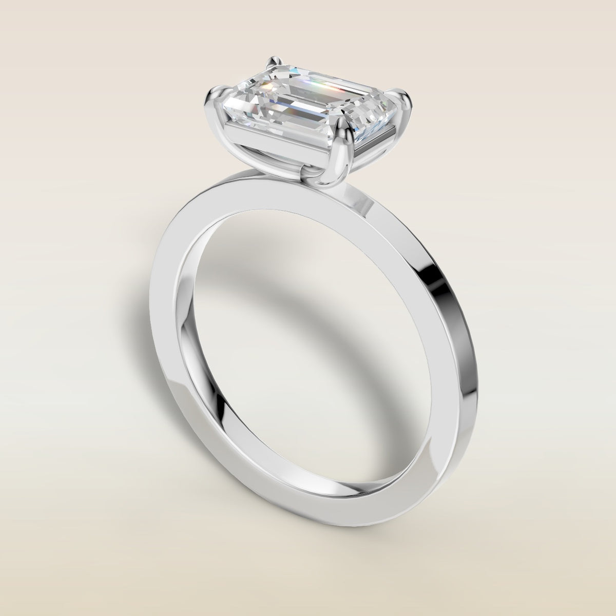 Emerald East West engagement ring in white gold, angled view
