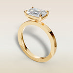 Emerald East West engagement ring in yellow gold, back angle