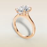 Oval Hidden Halo Cathedral engagement ring in rose gold, angled view