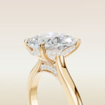 Cushion Curved Hidden Halo Diamond Bridge engagement ring in yellow gold, basket close up