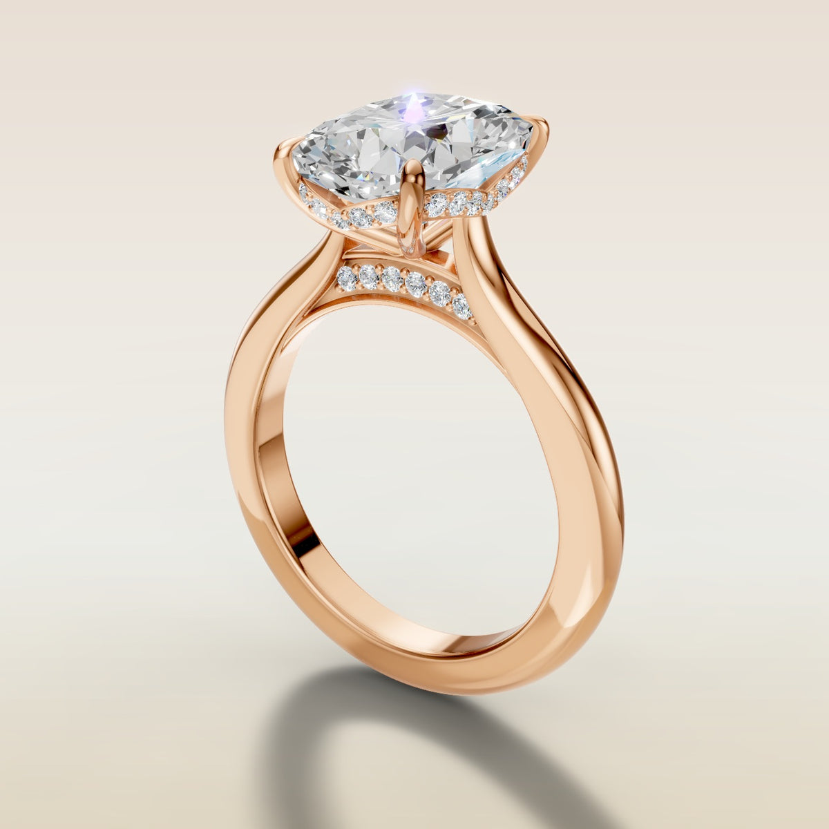 Cushion Curved Hidden Halo Diamond Bridge engagement ring in rose gold, angled side view