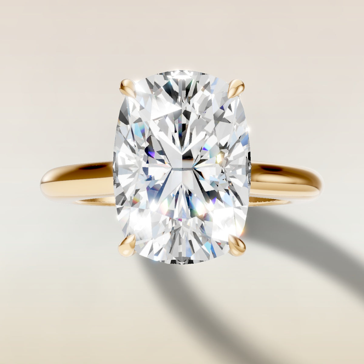 Cushion Curved Hidden Halo Diamond Bridge engagement ring in yellow gold, top view