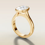 Cushion Full Bezel Cathedral engagement ring in gold, angled side view