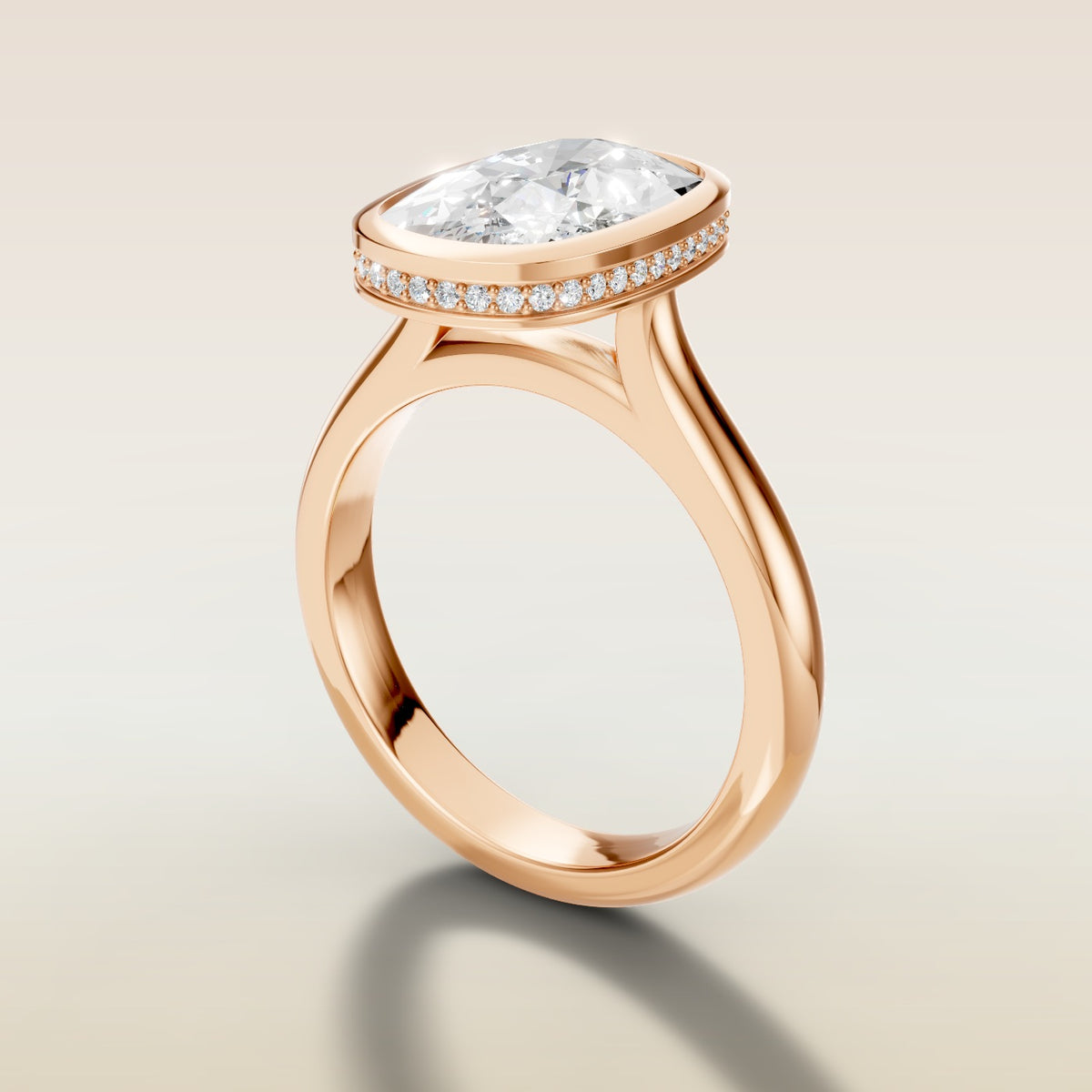 Cushion Full Bezel Hidden Halo engagement ring in rose gold, angled side view
