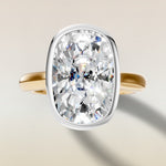Cushion Full Bezel Hidden Halo engagement ring in gold, top view