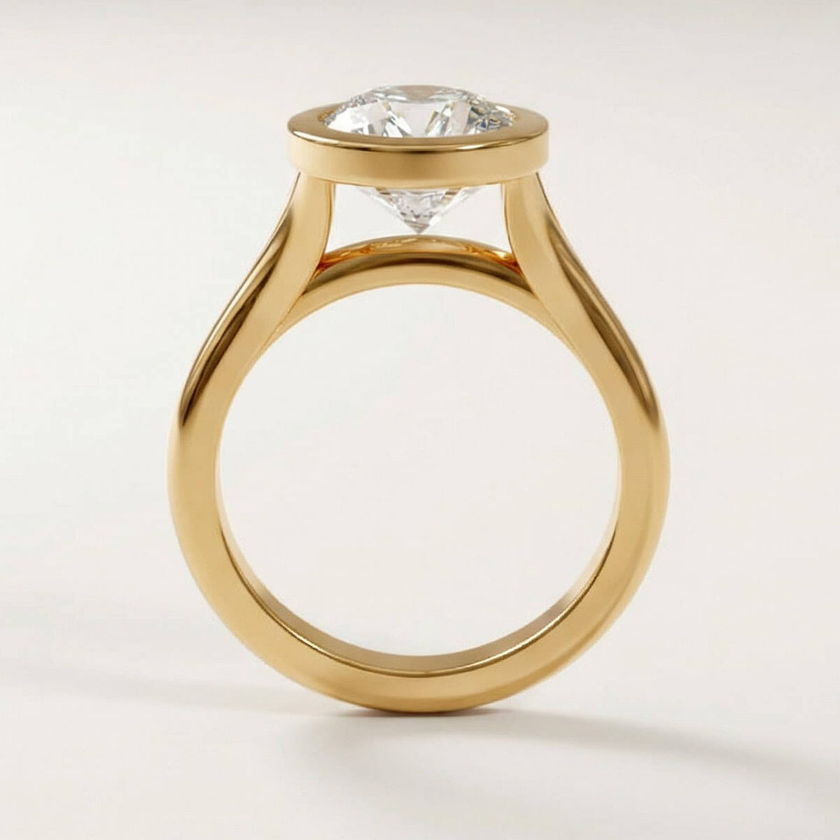 Full Bezel Split Shank engagement ring with a cushion diamond in yellow gold