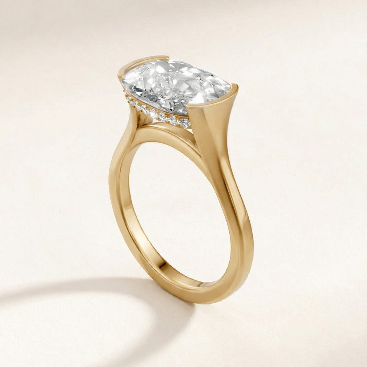 Half Bezel with Hidden Halo engagement ring with a cushion diamond in yellow gold