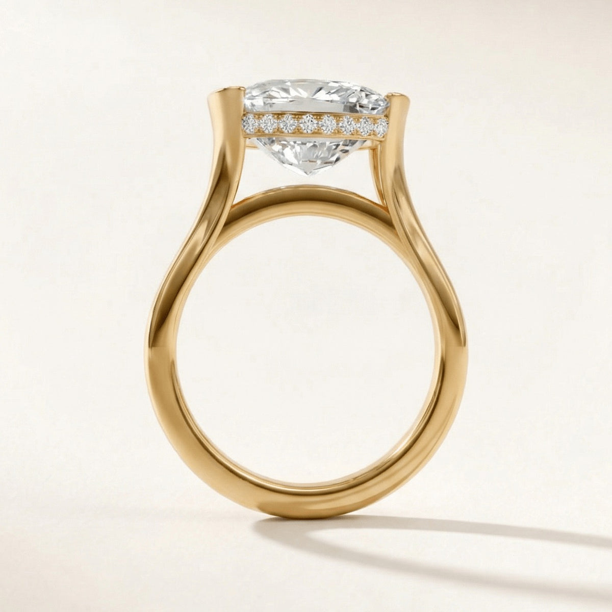 Half Bezel with Hidden Halo engagement ring with a cushion diamond in yellow gold