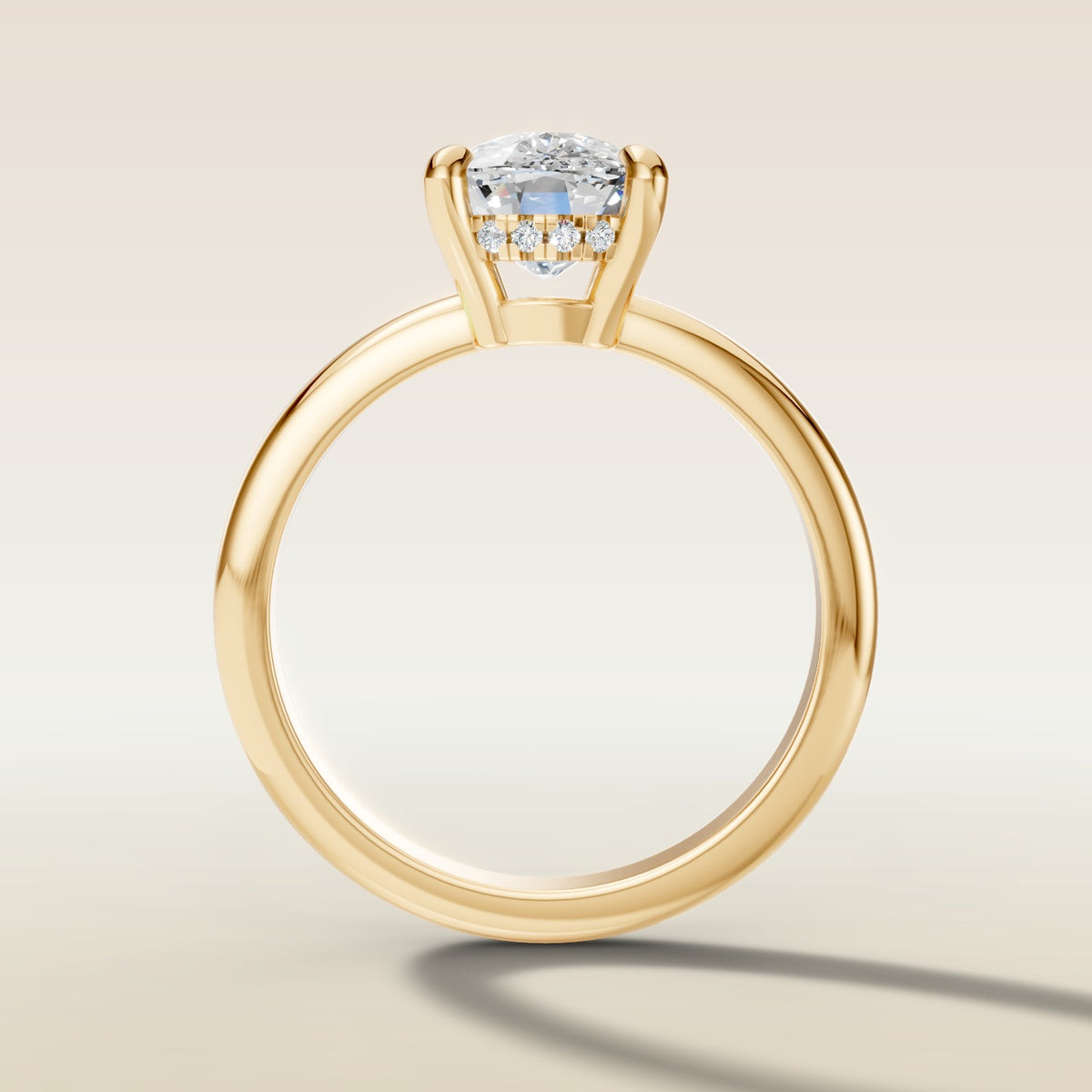 Cushion Low Profile Hidden Halo engagement ring in yellow gold, front view