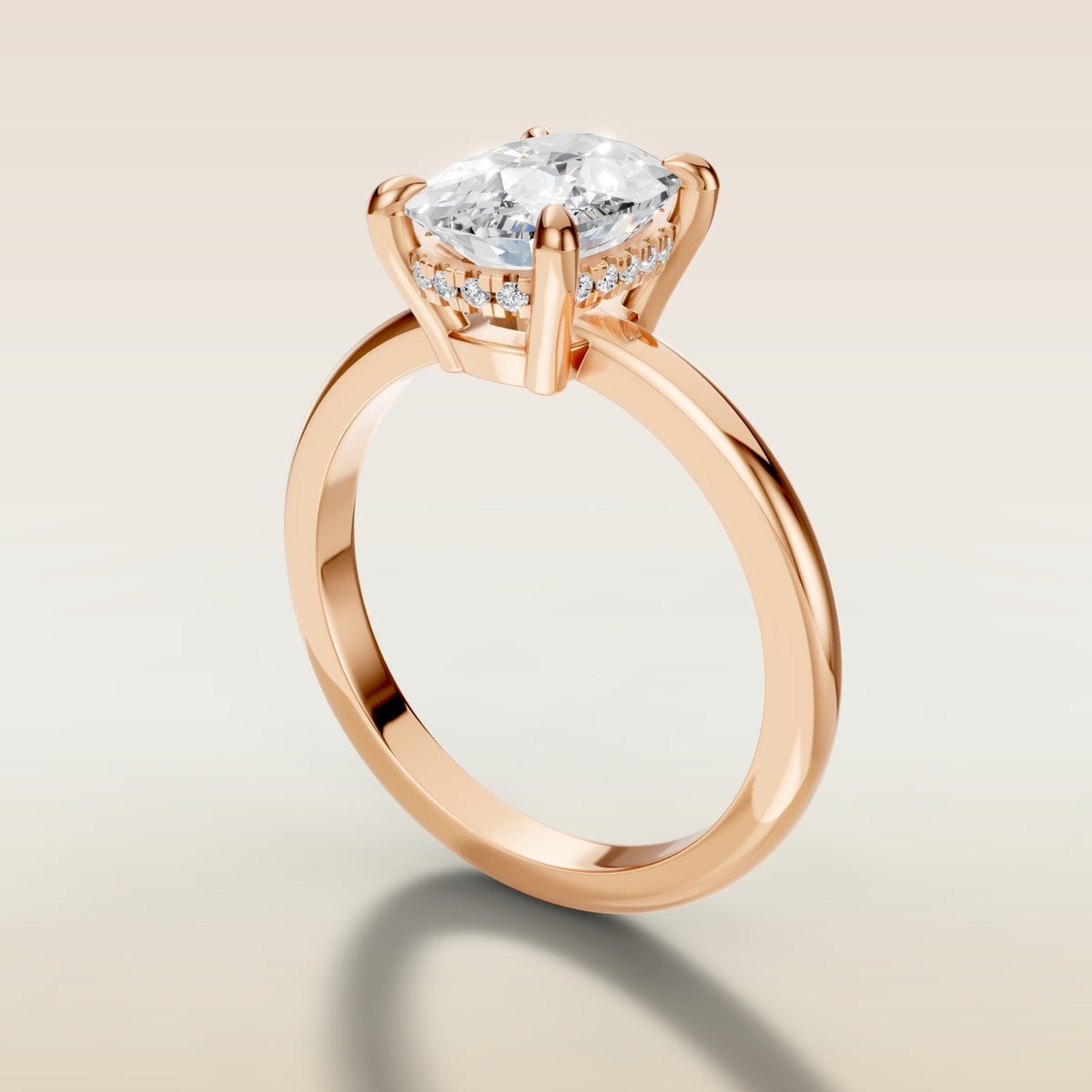 Cushion Low Profile Hidden Halo engagement ring in rose gold, angled side view
