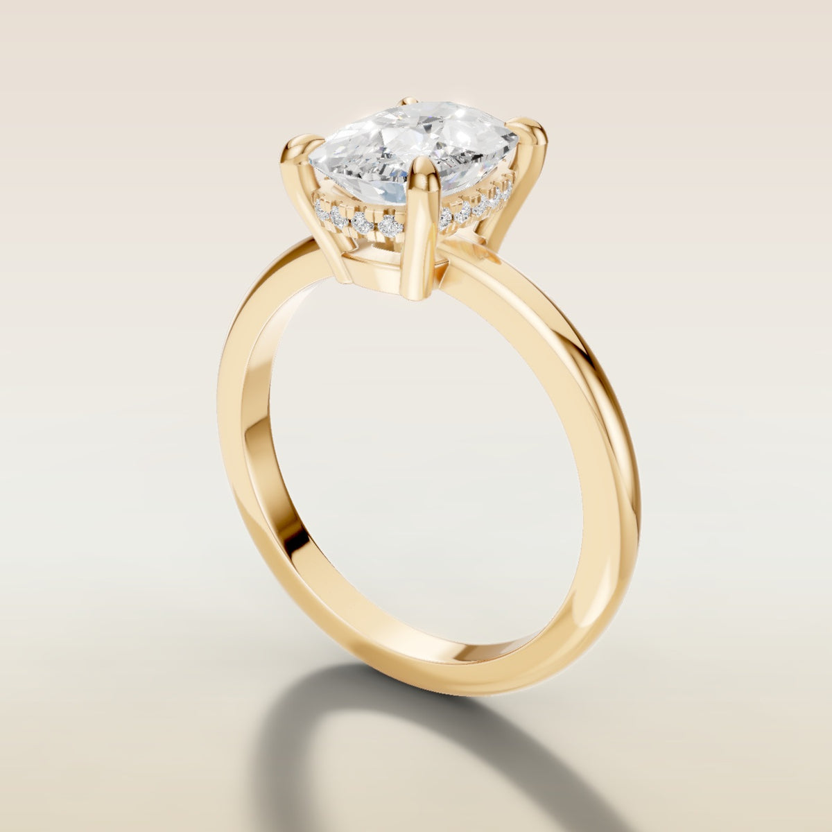 Cushion Low Profile Hidden Halo engagement ring in yellow gold, angled side view