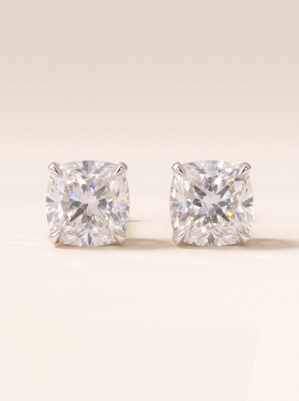Cushion diamond stud earrings in 14K white gold