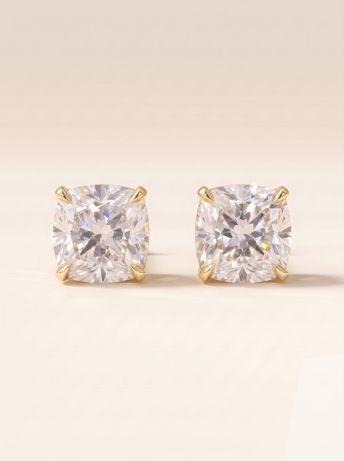 Cushion diamond stud earrings in 14K yellow gold