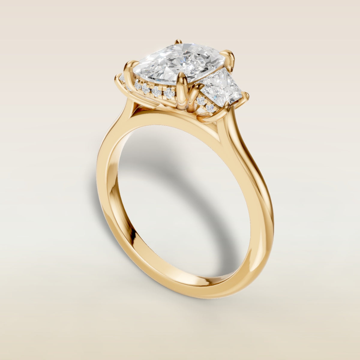 Cushion Three Stone Hidden Halo engagement ring in yellow gold, back angle
