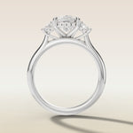 Cushion Three Stone Hidden Halo engagement ring in white gold, front view
