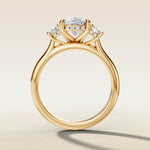 Cushion Three Stone Hidden Halo engagement ring in yellow gold, front view