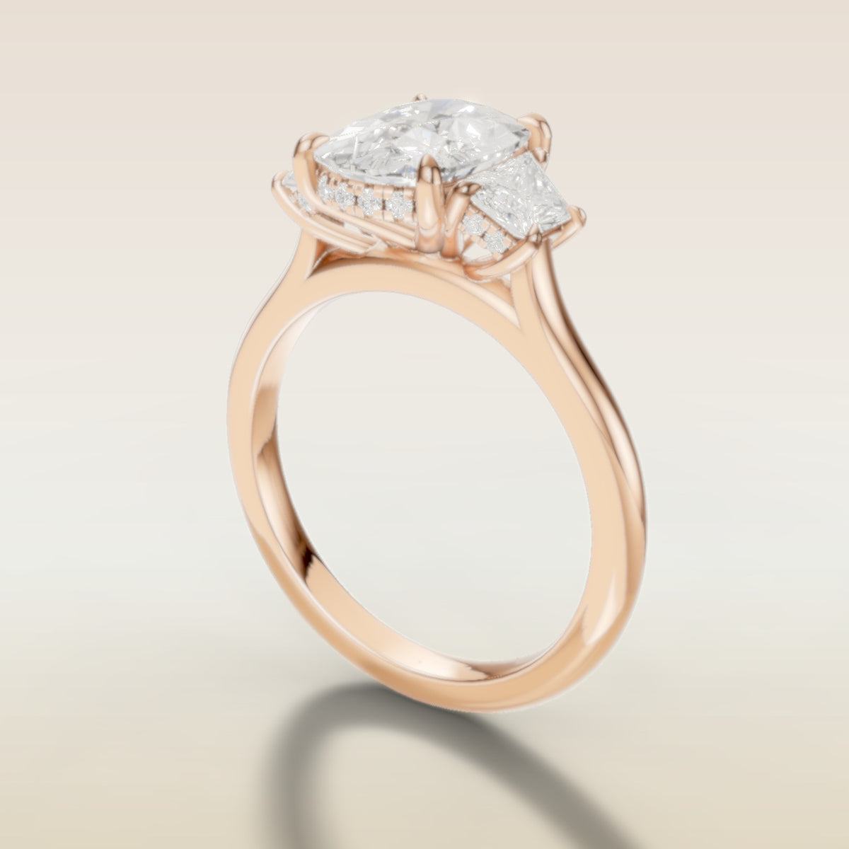 Cushion Three Stone Hidden Halo engagement ring in rose gold, angled side view