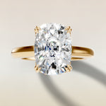 Cushion Tulip Curved Hidden Halo Double Prong engagement ring in yellow gold, top view