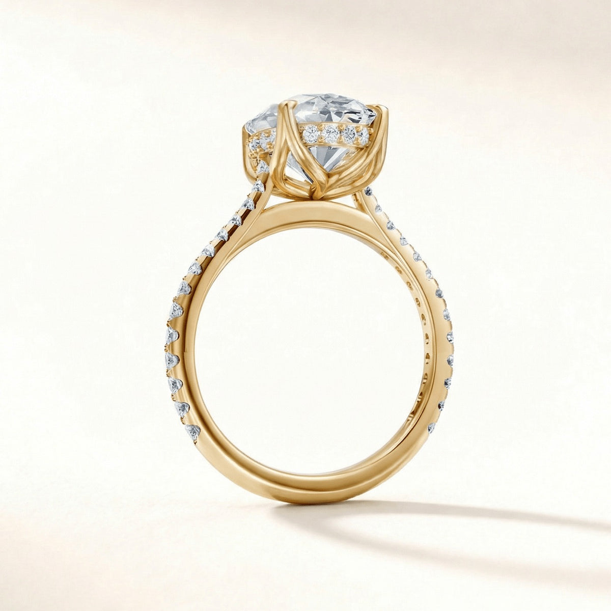 Tulip Hidden Halo Pave engagement ring with a cushion diamond in yellow gold