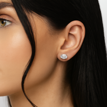 Oval lab grown diamond stud earrings worn