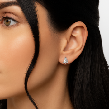 Pear shaped lab grown diamond stud earrings worn