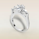 Oval Six Petal Tulip Three Stone engagement ring in white gold, angled view