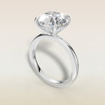 Round Hidden Halo Solitaire engagement ring in white gold, angled view