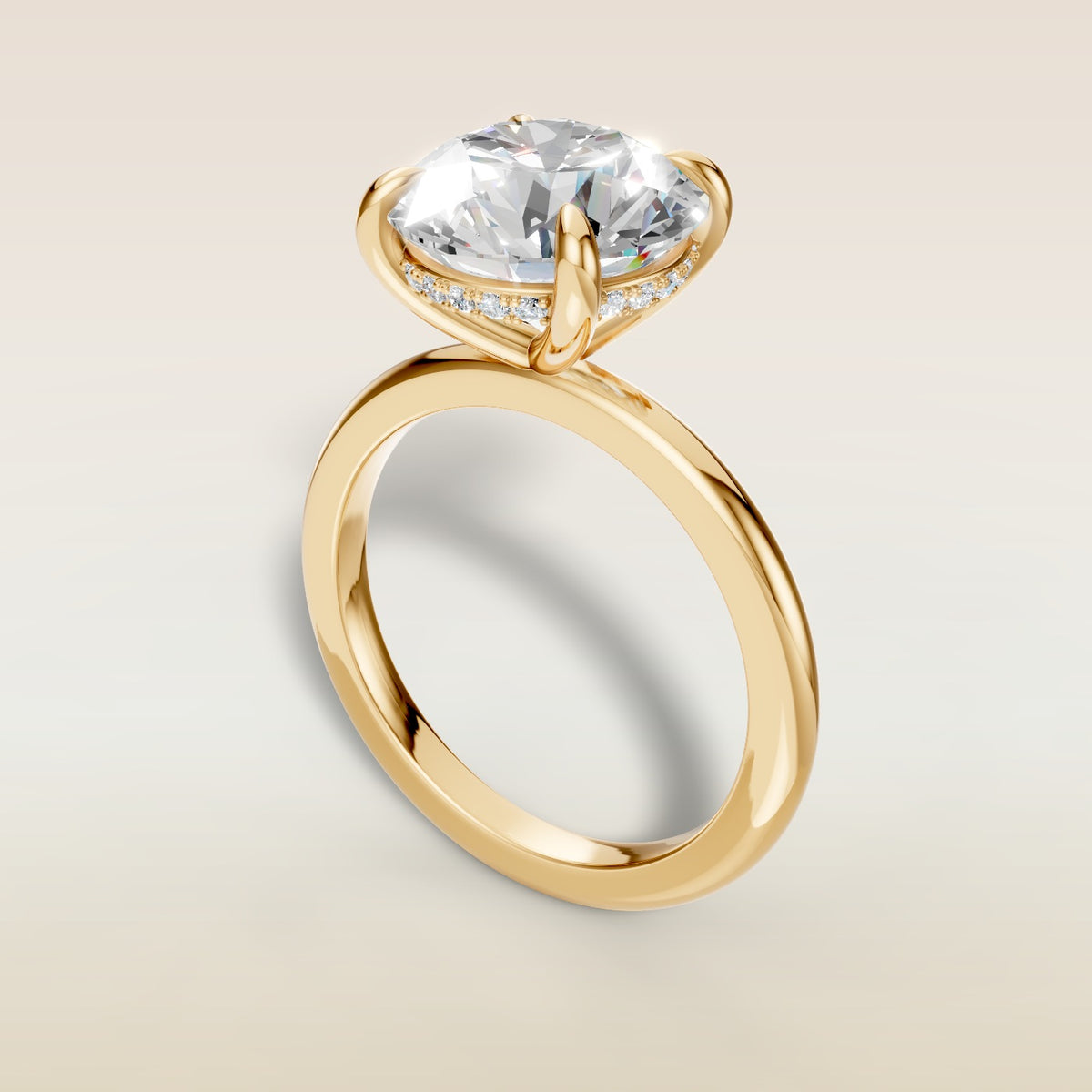 Round Hidden Halo Solitaire engagement ring in yellow gold, angled view