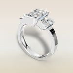 Emerald Three Stone Half Bezel Thick Band engagement ring in white gold, angled view