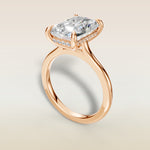 Radiant Hidden Halo Cathedral engagement ring in rose gold, angled view