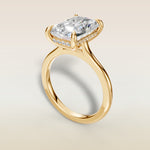 Radiant Hidden Halo Cathedral engagement ring in yellow gold, angled view