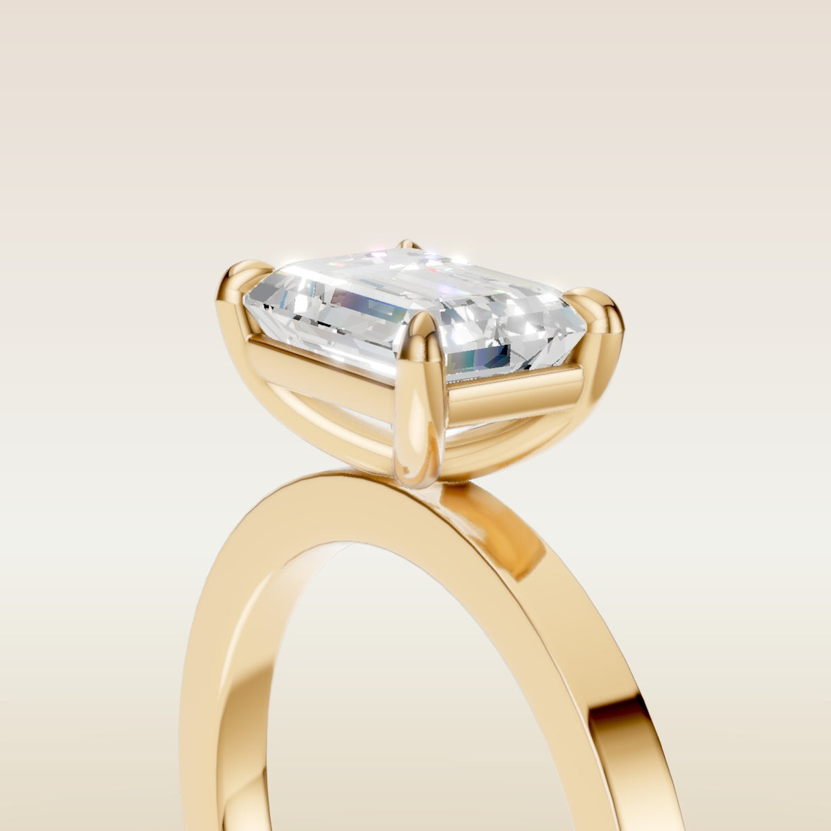 Emerald East West engagement ring in yellow gold, basket close up
