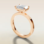 Emerald East West engagement ring in rose gold, angled side view