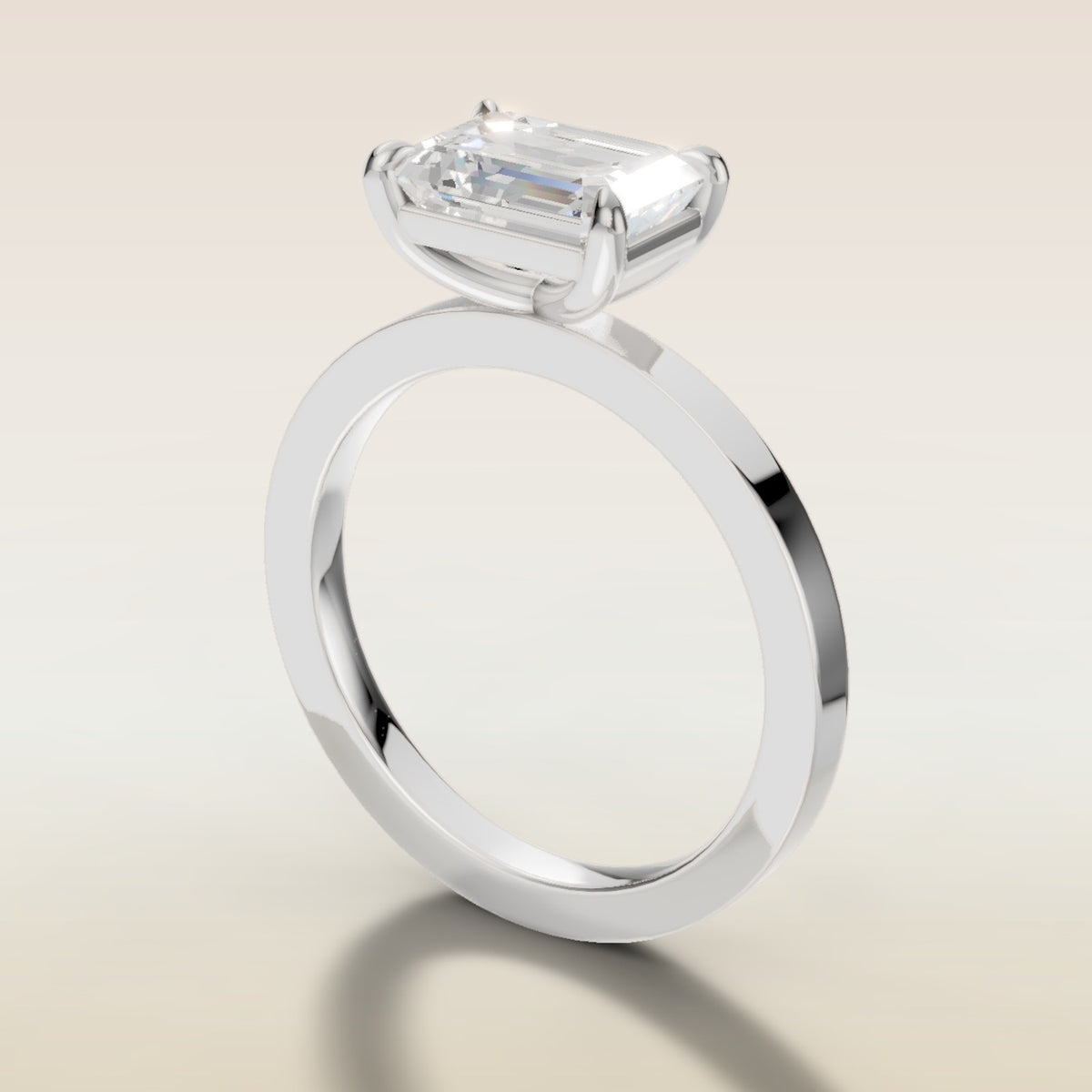 Emerald East West engagement ring in white gold, angled side view